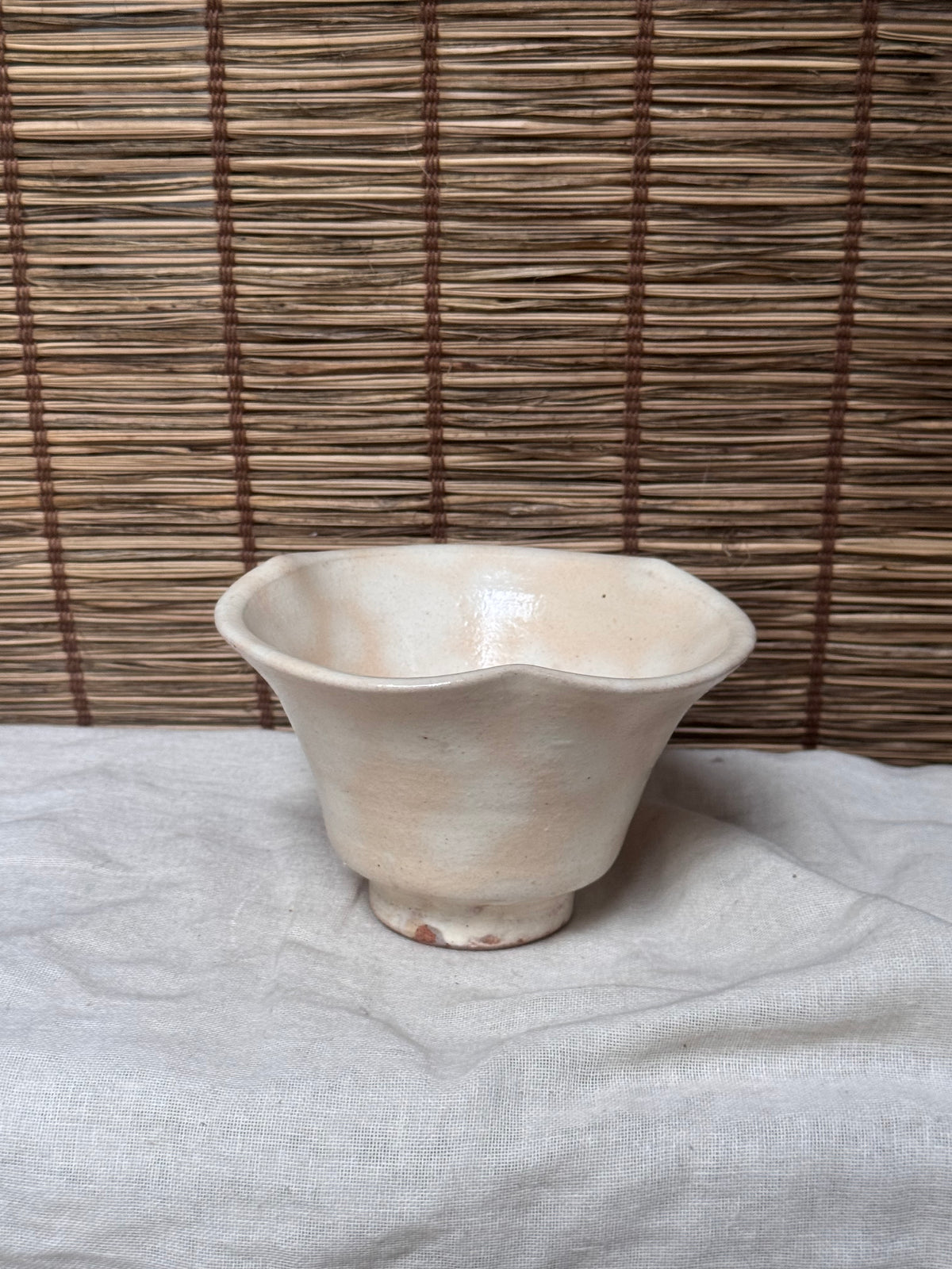 Hagi Ware Trumpet Cup — Wave-Rim Form, Ivory Glaze with Iron Blush
