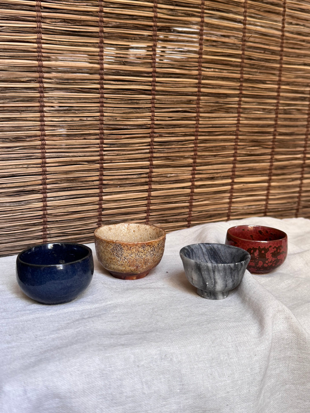 Four Mismatched Guinomi Sake Cups — Cobalt Blue, Crackled Ivory, Marbled Grey, Oxblood Speckle