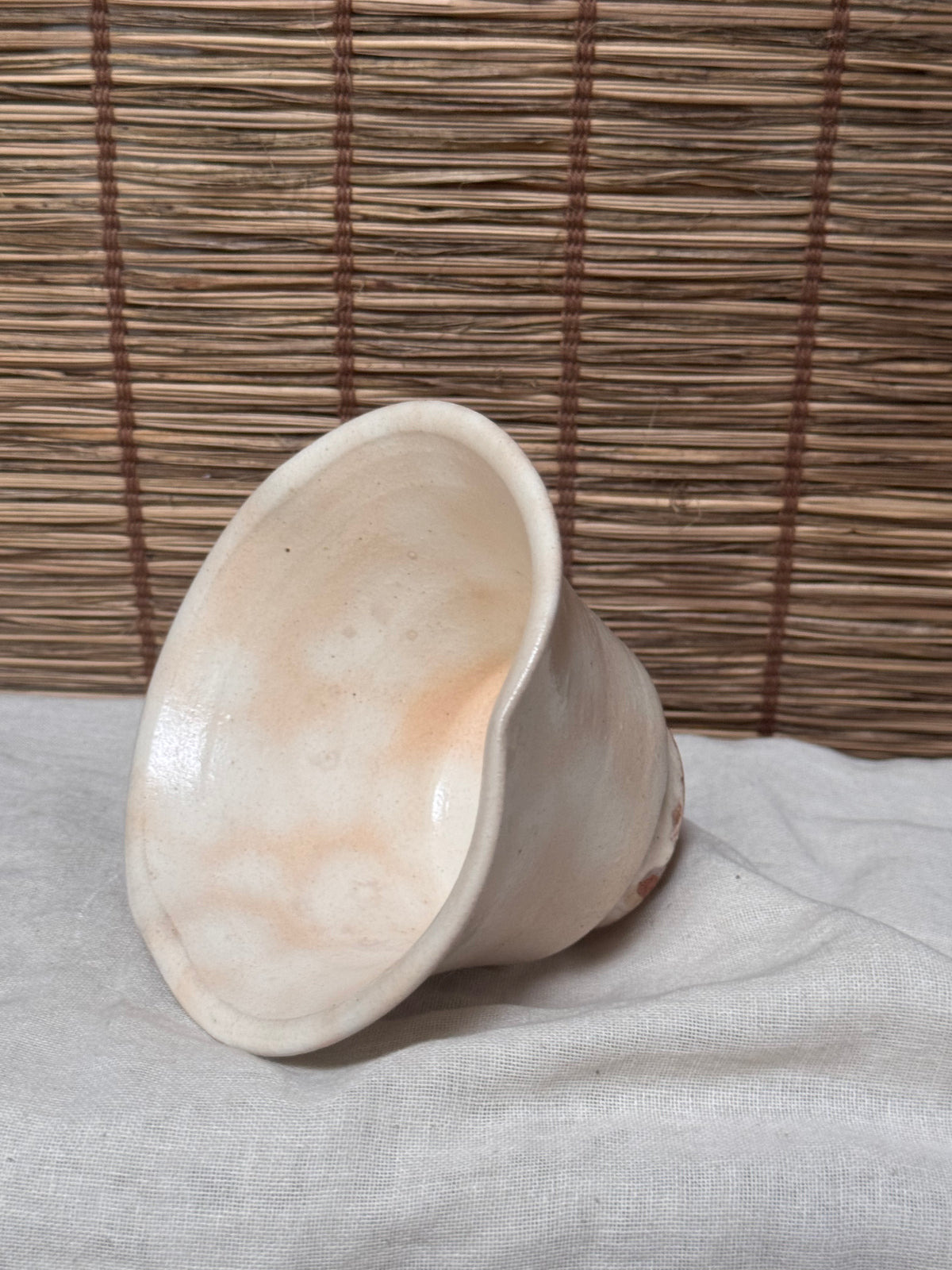 Hagi Ware Trumpet Cup — Wave-Rim Form, Ivory Glaze with Iron Blush