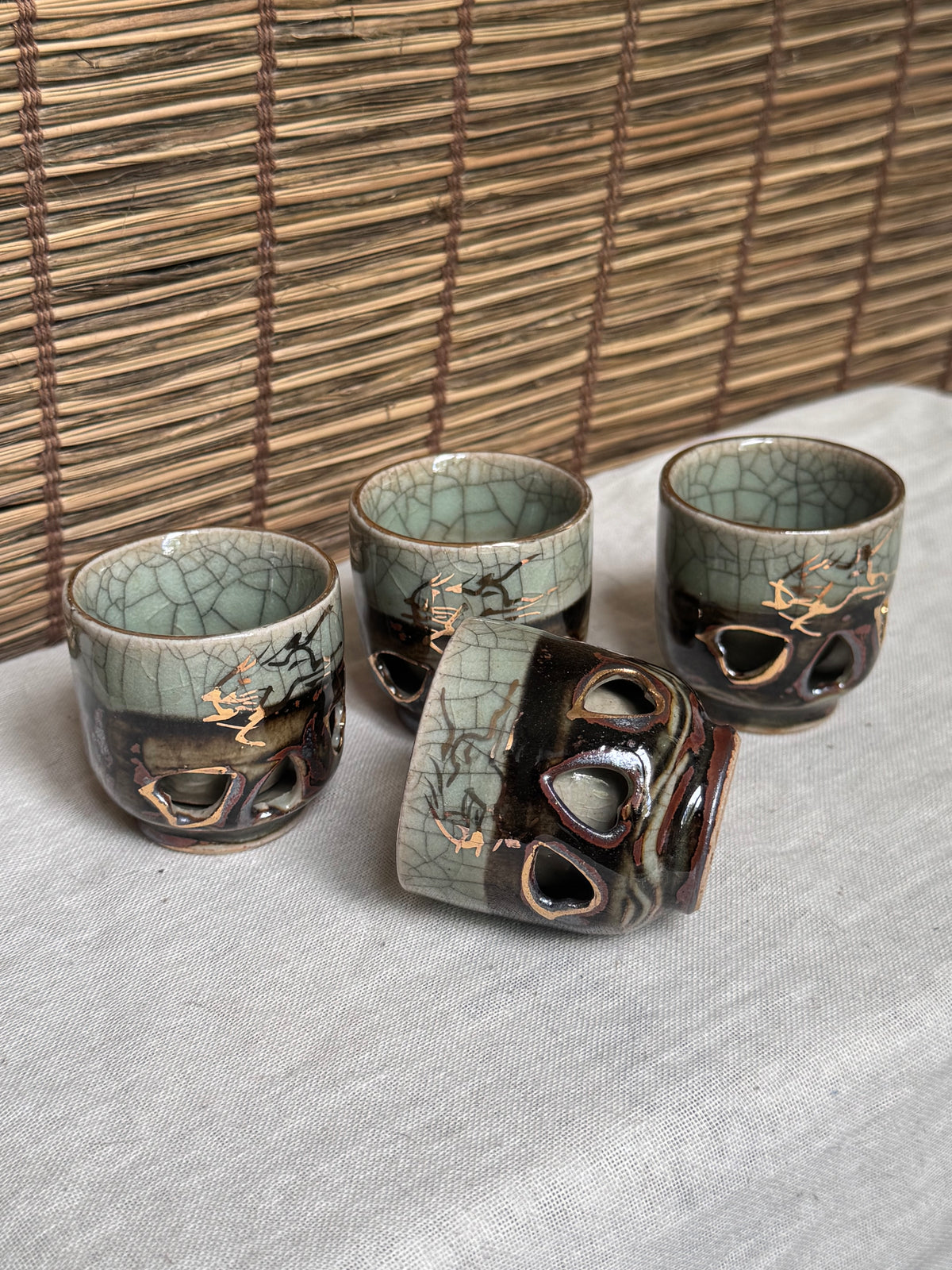 Sōma-yaki Double-Walled Cups, Set of 4 — Crackle Celadon Glaze, Cutout Design, Horse Gold Accents