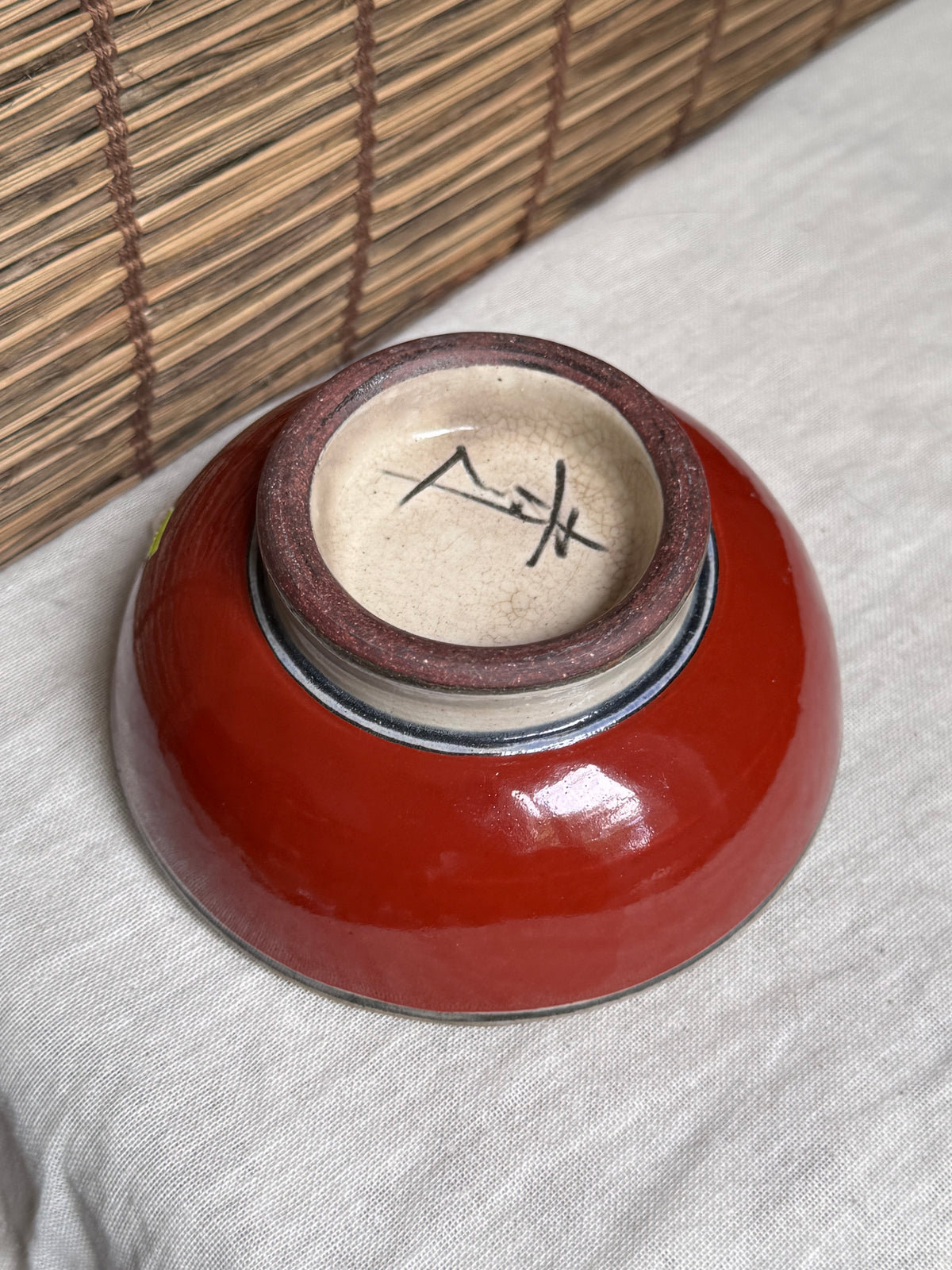 Tsuboya Ware by Toshiyuki Kinjo Rice Bowl — Copper-Red Glaze, Medallion Fish Motif