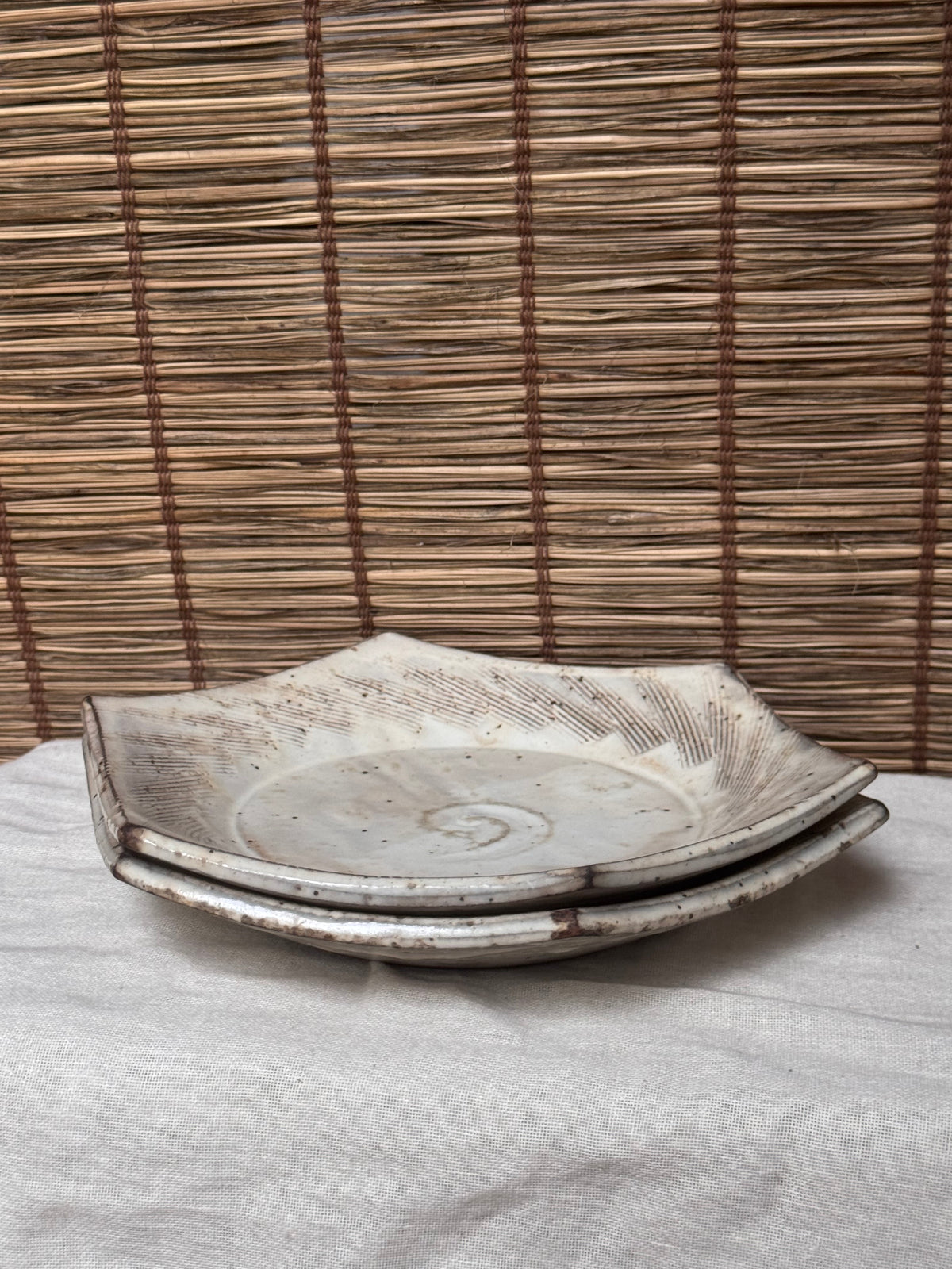 Hexagonal Studio Clip Sunburst Dishes, Pair — Combed Radiating Lines, Spiral Center, Speckled White Glaze