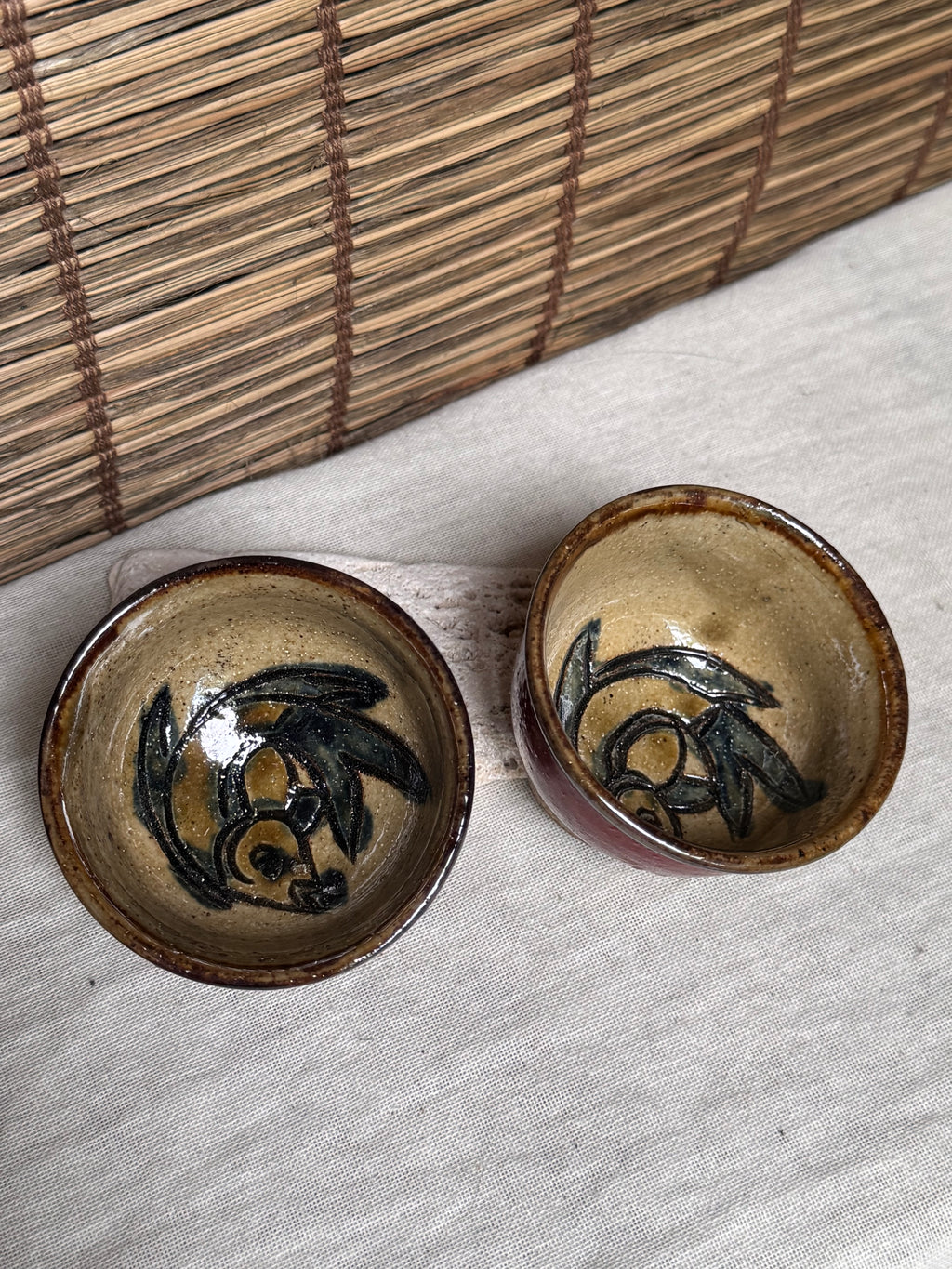Tsuboya Ware by Arakaki Isao Tea Cup Pair — Iron-Painted Fish Motif