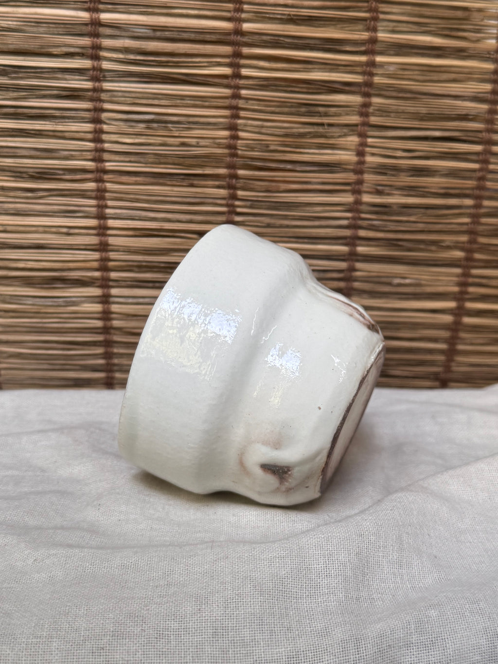 Maori White Glazed Stoneware Mug — Looped Handle, Stamped Maker's Mark, Iron-Spot Accents