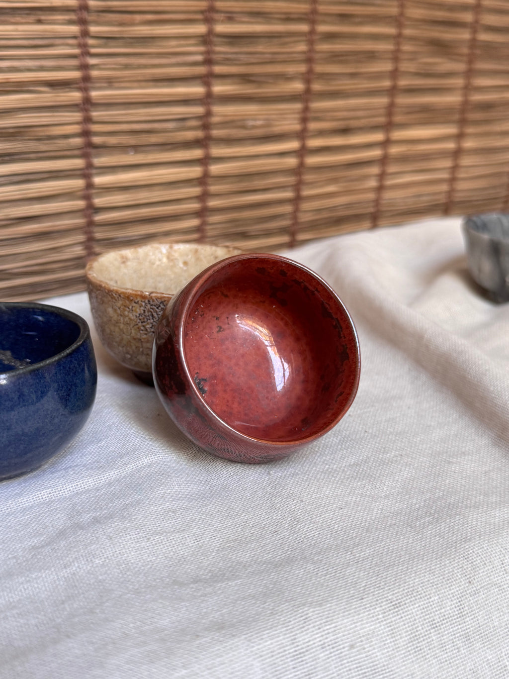 Four Mismatched Guinomi Sake Cups — Cobalt Blue, Crackled Ivory, Marbled Grey, Oxblood Speckle