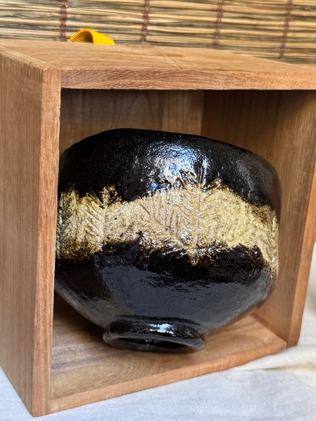 Shōraku Kiln Kuro-Raku Chawan — Incised Pine Forest Band, with Wooden Box