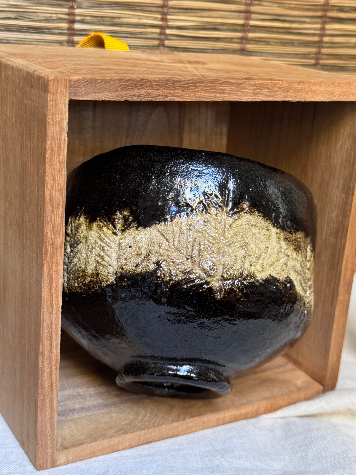 Shōraku Kiln Kuro-Raku Chawan — Incised Pine Forest Band, with Wooden Box