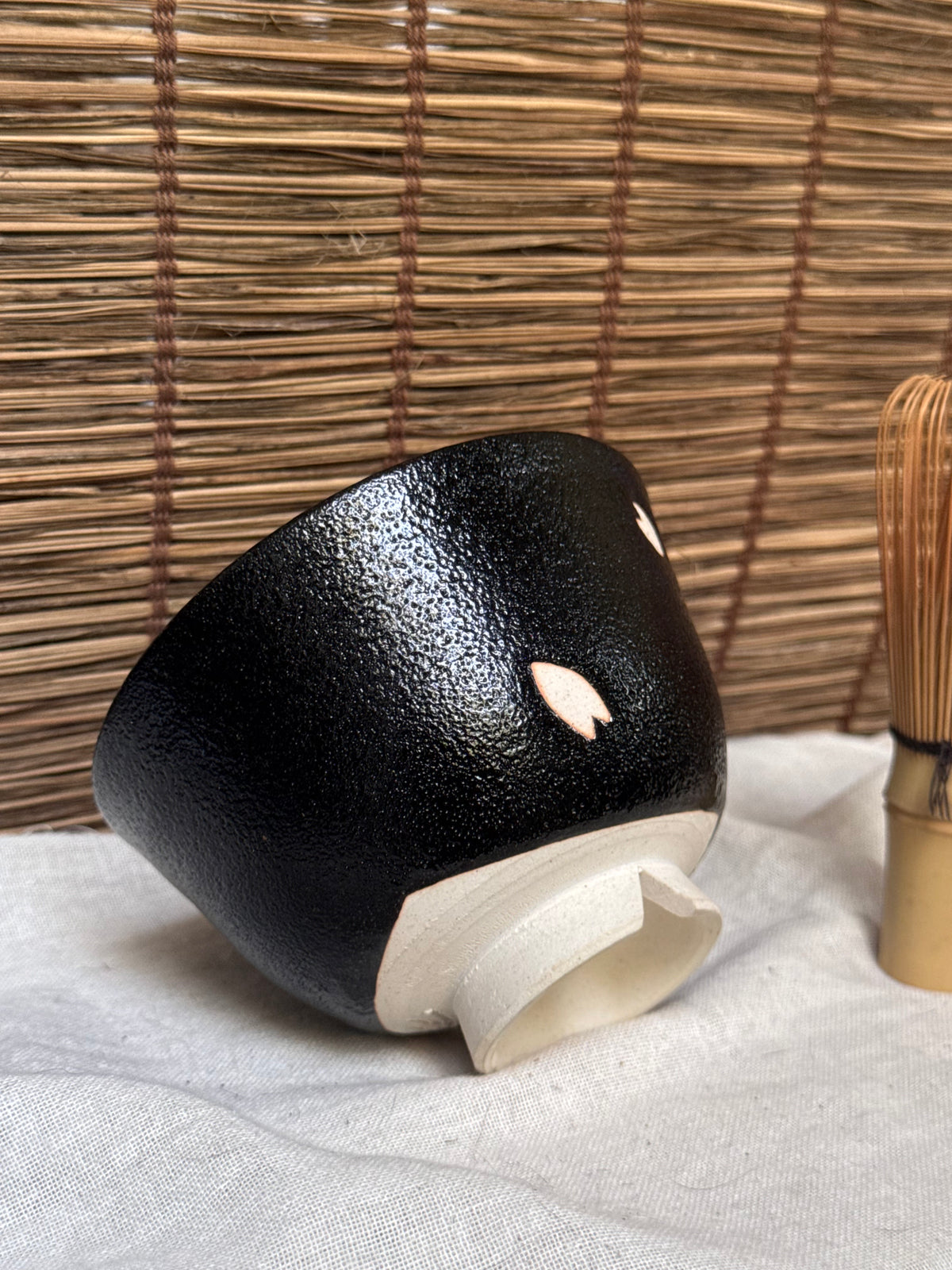 Seto-yaki by Yoshiki Sugiura Matcha Chawan — Black Glaze with Cut-Out Cherry Blossom Petals, Split Foot, Signed & Boxed