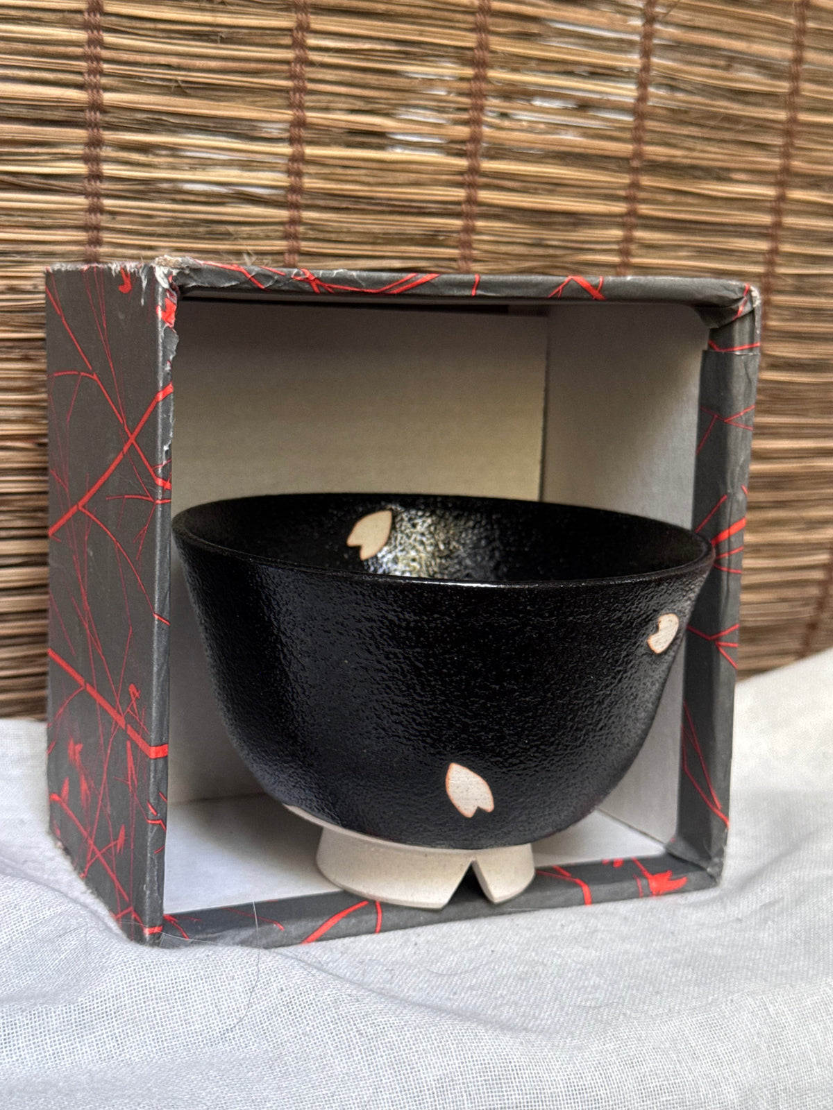 Seto-yaki by Yoshiki Sugiura Matcha Chawan — Black Glaze with Cut-Out Cherry Blossom Petals, Split Foot, Signed & Boxed