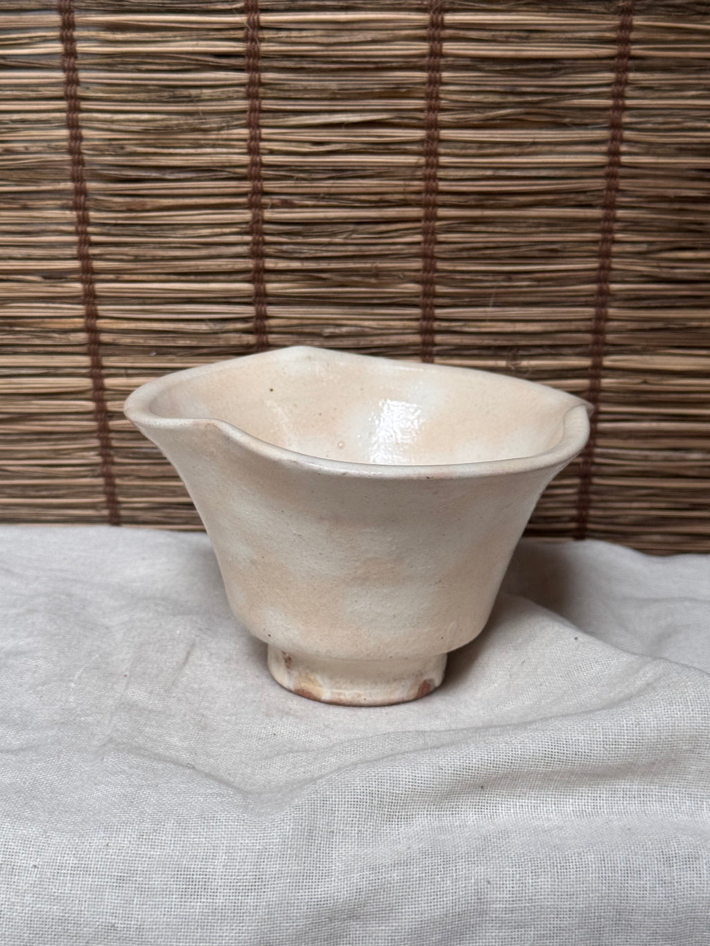 Hagi Ware Trumpet Cup — Wave-Rim Form, Ivory Glaze with Iron Blush
