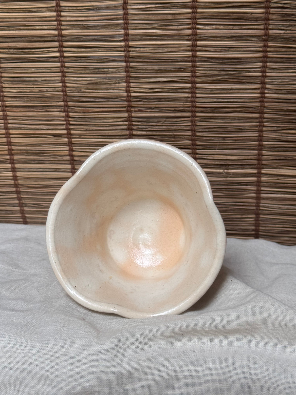 Hagi Ware Trumpet Cup — Wave-Rim Form, Ivory Glaze with Iron Blush