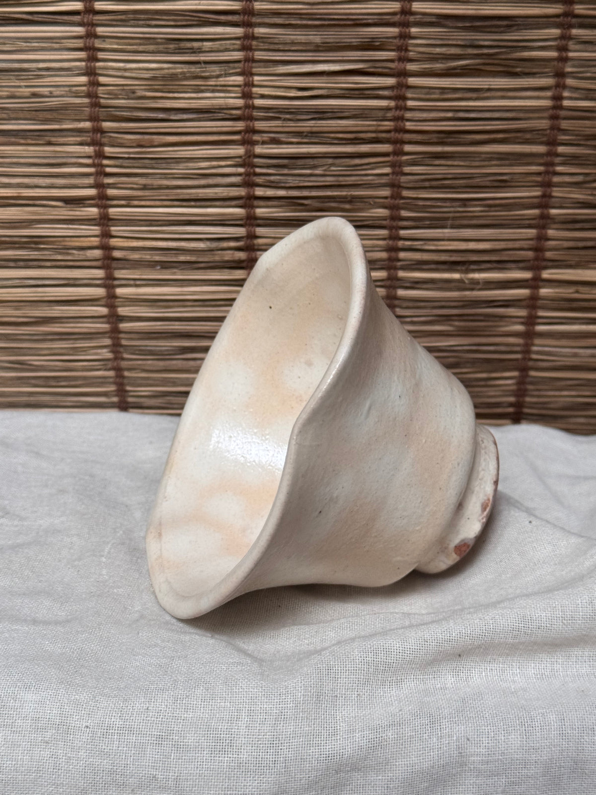 Hagi Ware Trumpet Cup — Wave-Rim Form, Ivory Glaze with Iron Blush