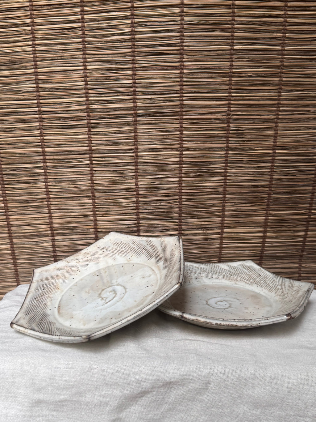 Hexagonal Studio Clip Sunburst Dishes, Pair — Combed Radiating Lines, Spiral Center, Speckled White Glaze