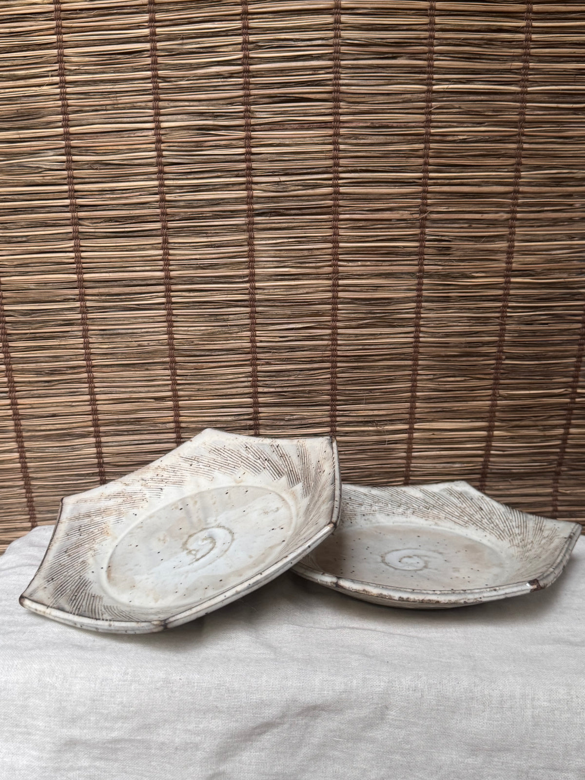 Hexagonal Studio Clip Sunburst Dishes, Pair — Combed Radiating Lines, Spiral Center, Speckled White Glaze