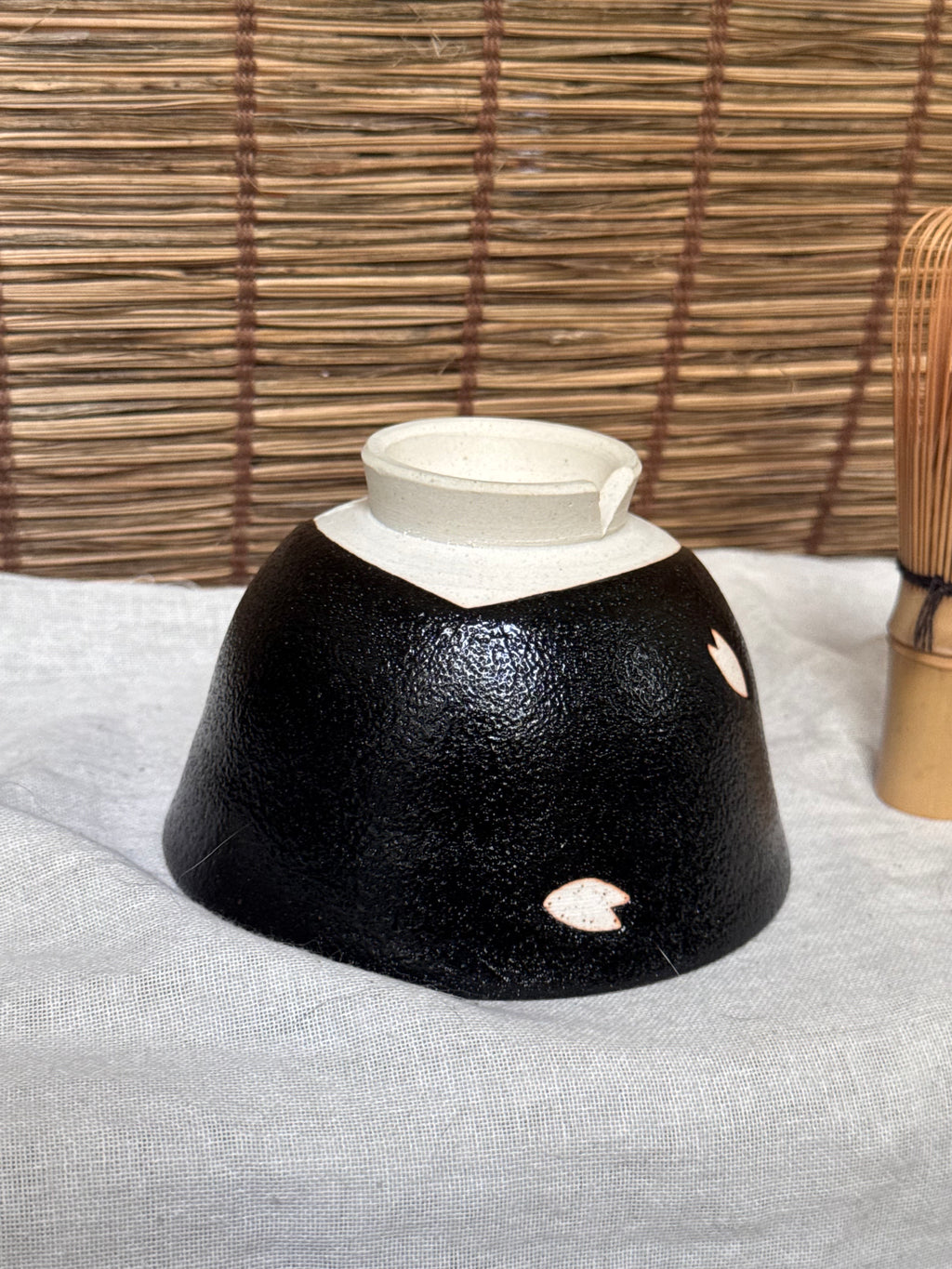 Seto-yaki by Yoshiki Sugiura Matcha Chawan — Black Glaze with Cut-Out Cherry Blossom Petals, Split Foot, Signed & Boxed