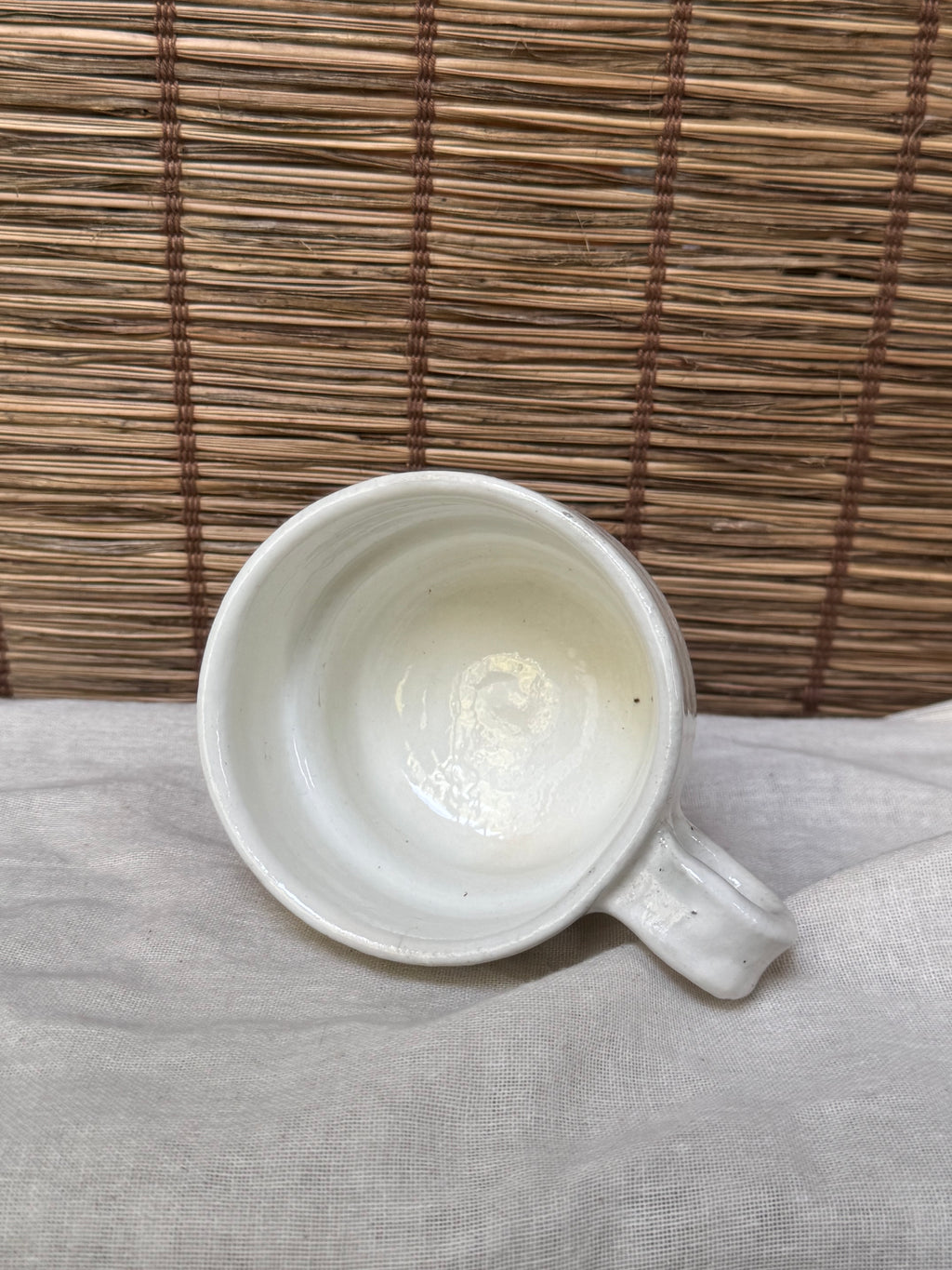 Maori White Glazed Stoneware Mug — Looped Handle, Stamped Maker's Mark, Iron-Spot Accents