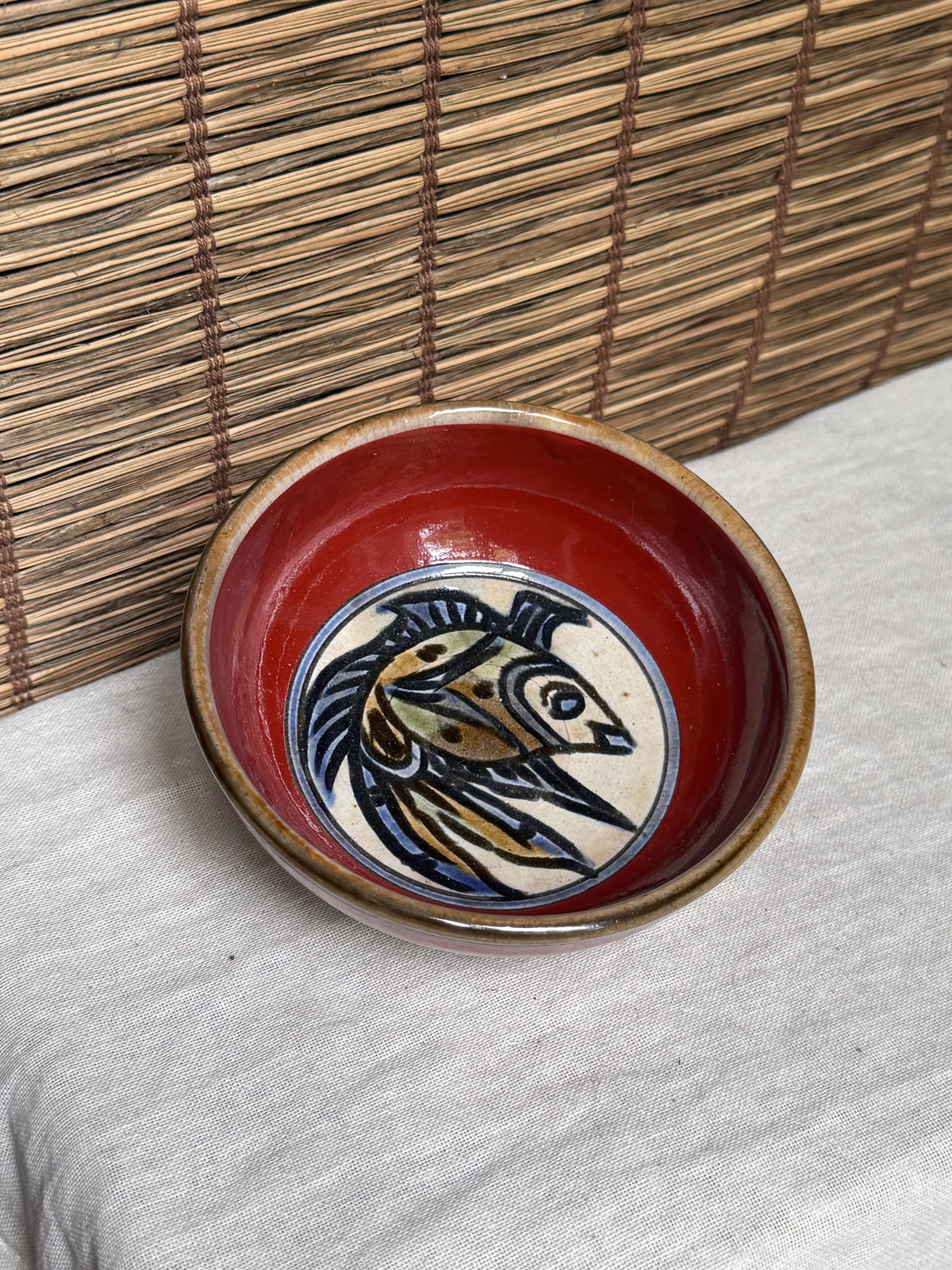 Tsuboya Ware by Toshiyuki Kinjo Rice Bowl — Copper-Red Glaze, Medallion Fish Motif