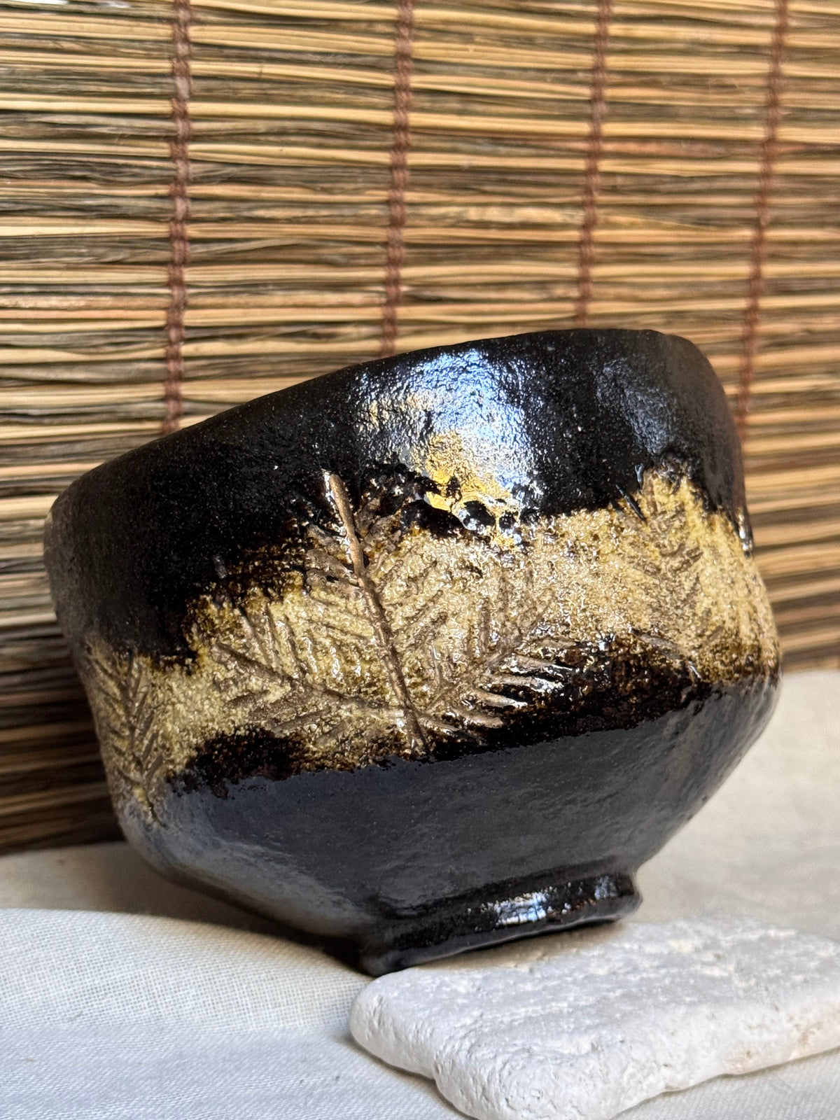 Shōraku Kiln Kuro-Raku Chawan — Incised Pine Forest Band, with Wooden Box