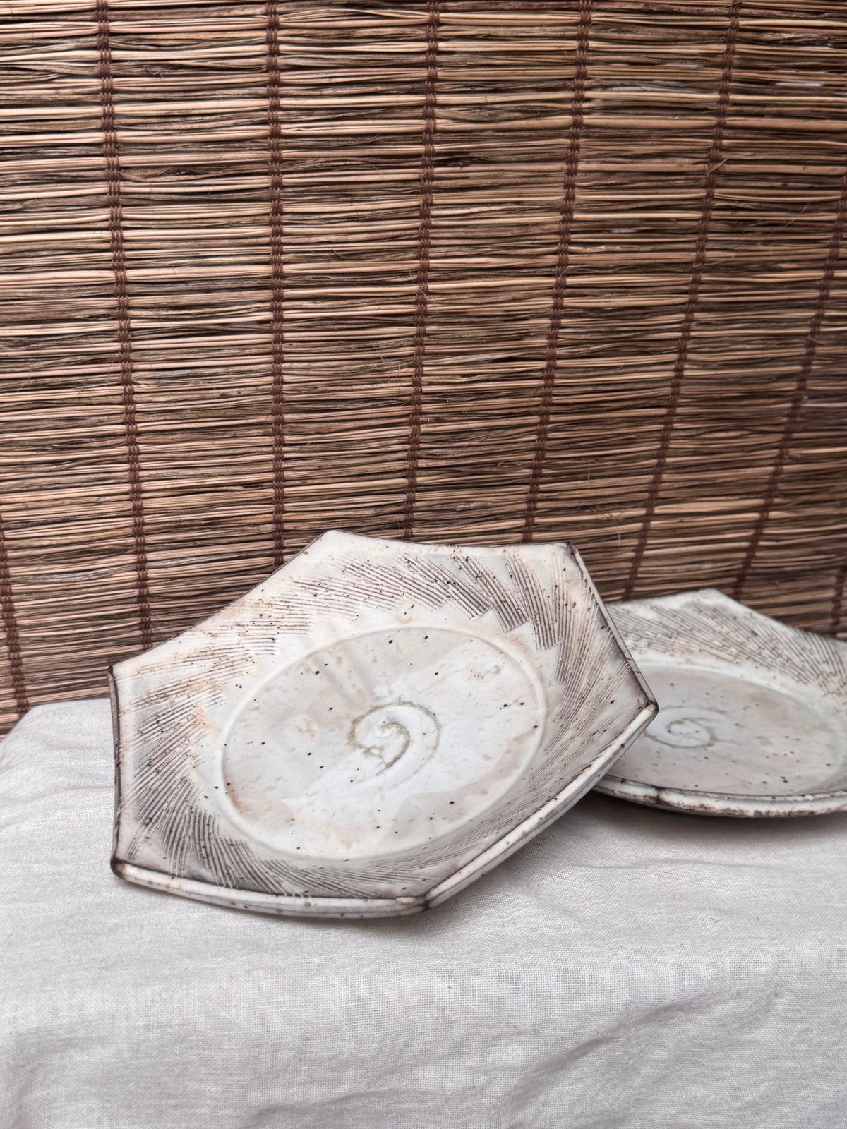 Hexagonal Studio Clip Sunburst Dishes, Pair — Combed Radiating Lines, Spiral Center, Speckled White Glaze