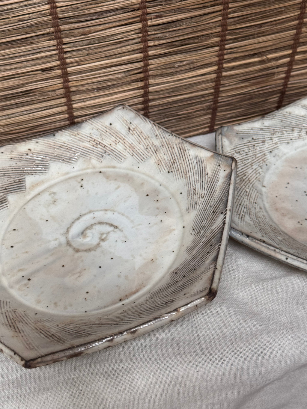 Hexagonal Studio Clip Sunburst Dishes, Pair — Combed Radiating Lines, Spiral Center, Speckled White Glaze