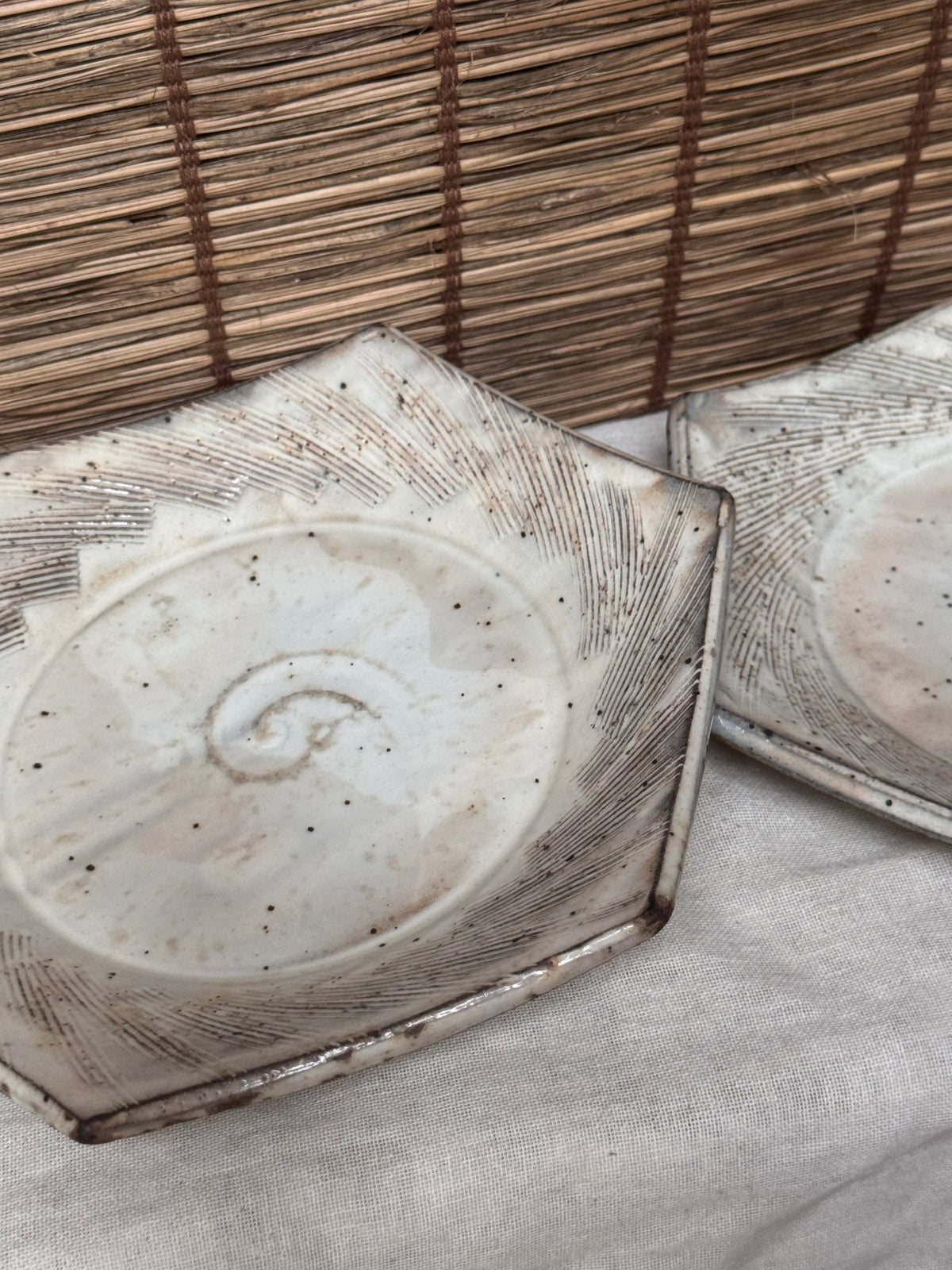 Hexagonal Studio Clip Sunburst Dishes, Pair — Combed Radiating Lines, Spiral Center, Speckled White Glaze