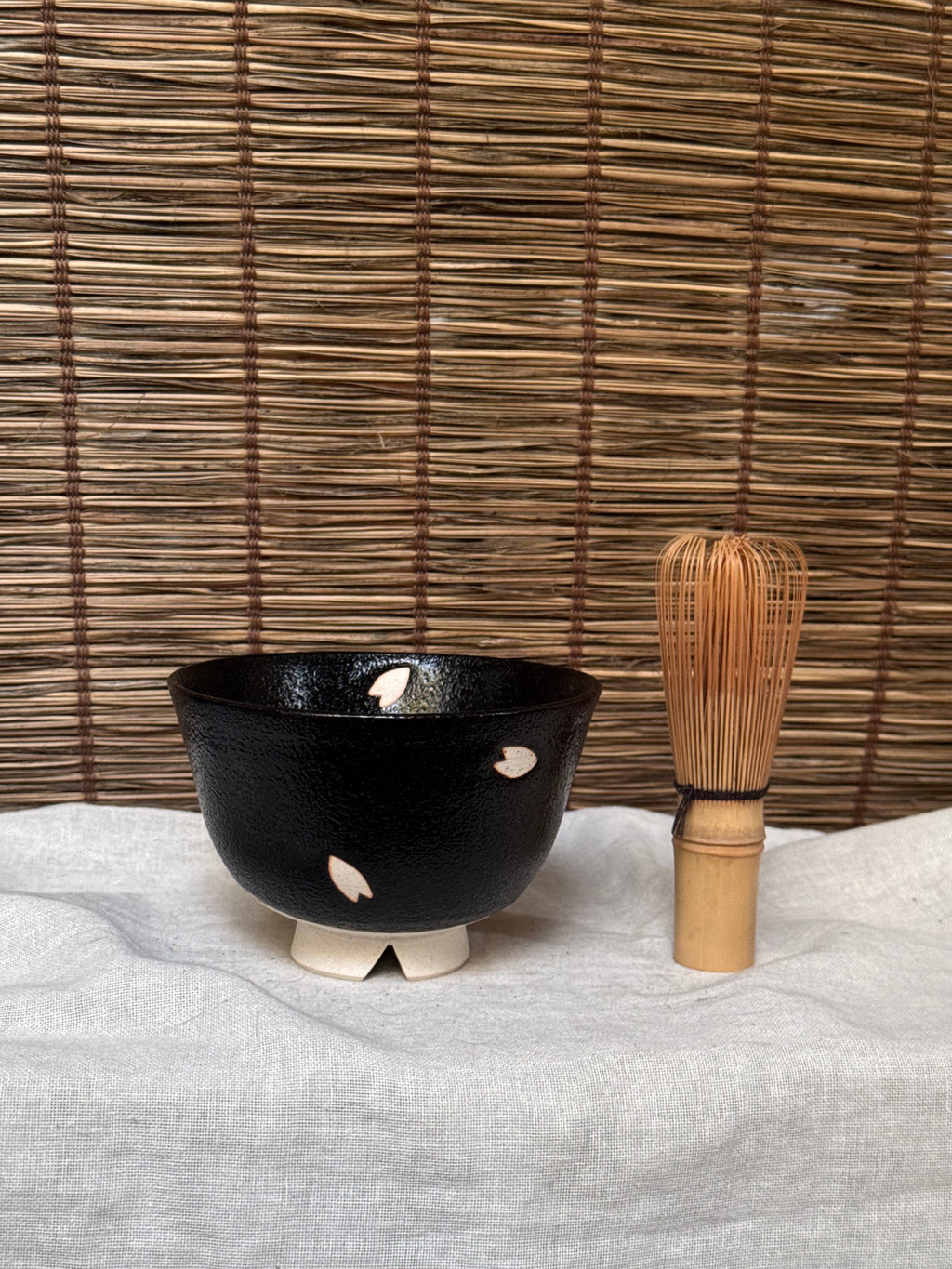 Seto-yaki by Yoshiki Sugiura Matcha Chawan — Black Glaze with Cut-Out Cherry Blossom Petals, Split Foot, Signed & Boxed