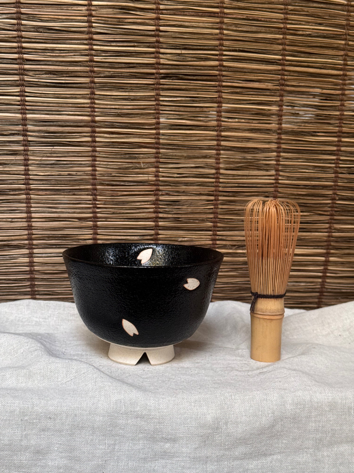 Seto-yaki by Yoshiki Sugiura Matcha Chawan — Black Glaze with Cut-Out Cherry Blossom Petals, Split Foot, Signed & Boxed