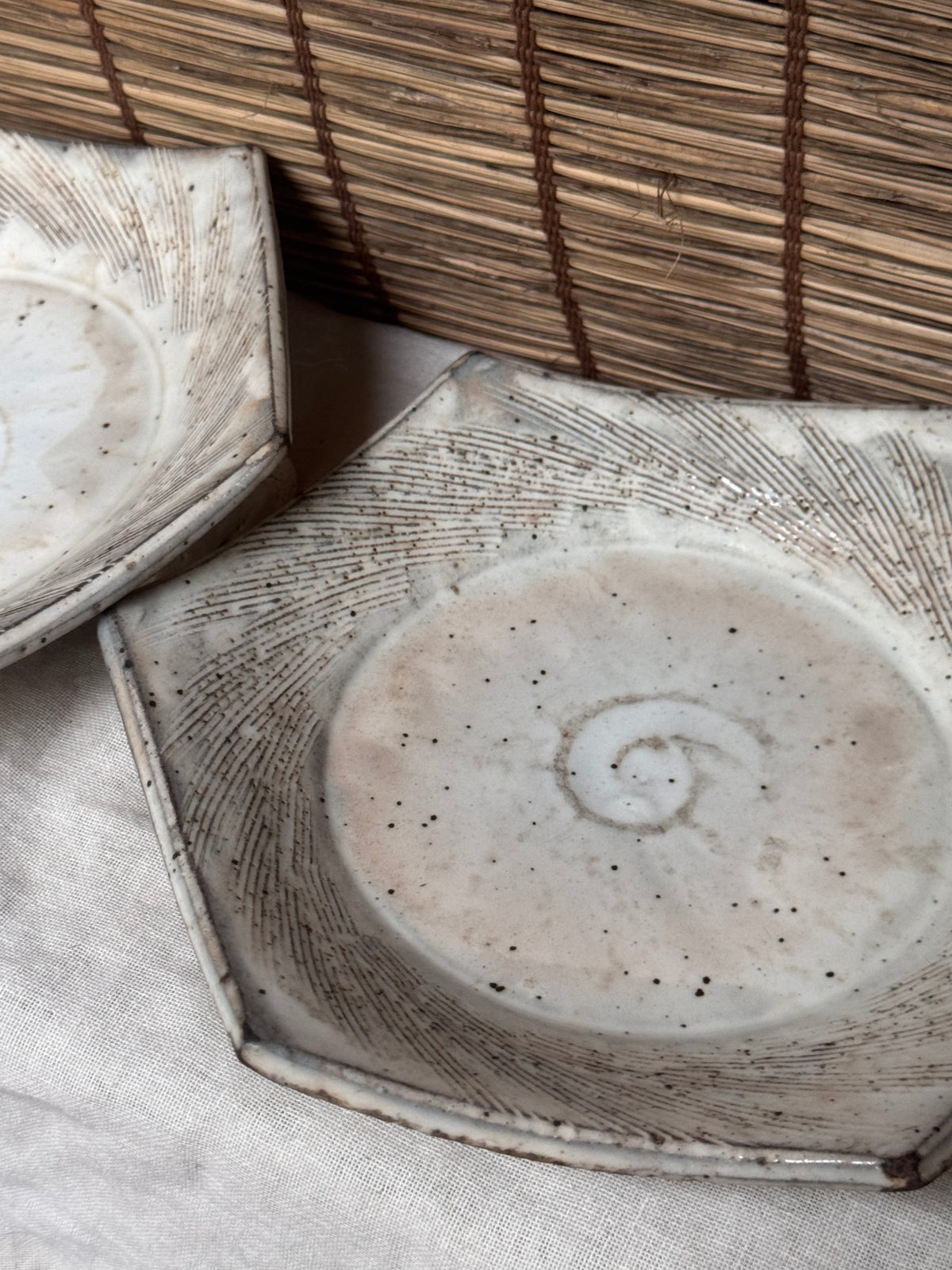 Hexagonal Studio Clip Sunburst Dishes, Pair — Combed Radiating Lines, Spiral Center, Speckled White Glaze