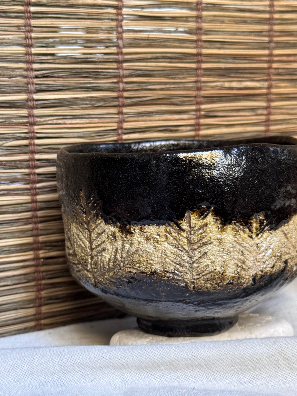 Shōraku Kiln Kuro-Raku Chawan — Incised Pine Forest Band, with Wooden Box