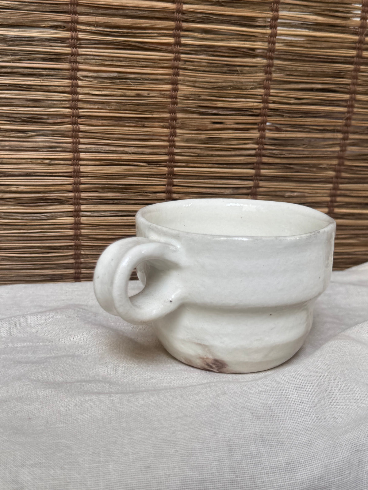 Maori White Glazed Stoneware Mug — Looped Handle, Stamped Maker's Mark, Iron-Spot Accents